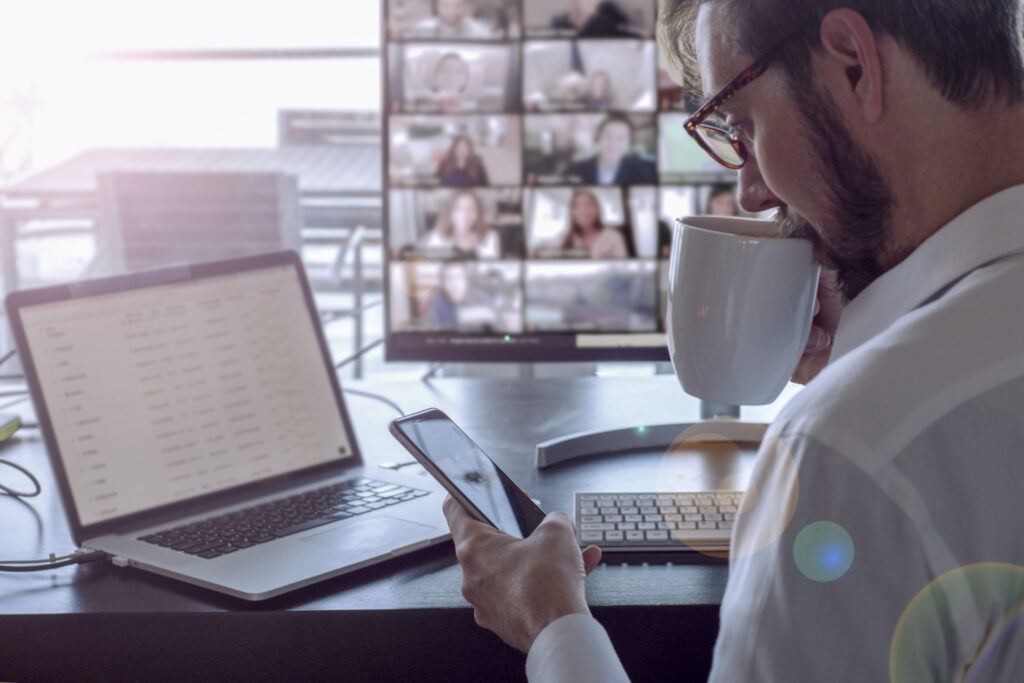 Man attending virtual conference during COVID-19 