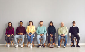 Diverse patients sitting in a waiting room
