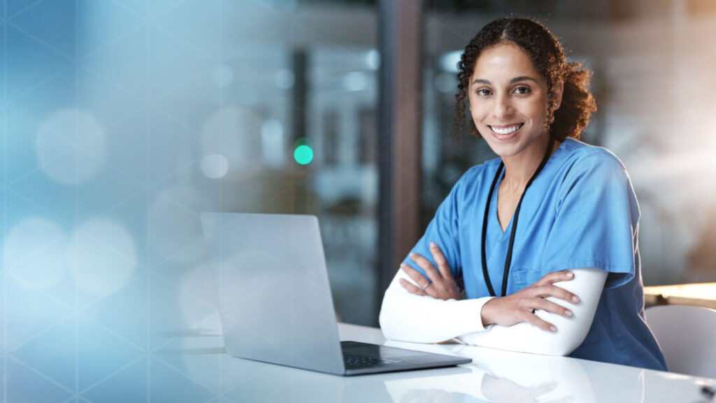 A female doctor wearing blue scrubs is participating in a digital program