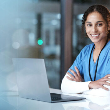 A female doctor wearing blue scrubs is participating in a digital program