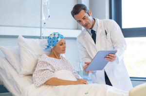 A male doctor is explaining the test results to a patient with advanced cancer