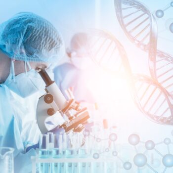 Biotechnology concept: a researcher is looking at something through a microscope, with enlarged DNA strands shown on the right side of the image